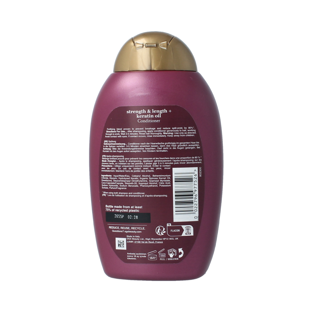 OGX Anti-Breakage Keratin Oil Conditioner bottle, 385ml, with a sleek pump dispenser, showcasing healthy, shiny hair.