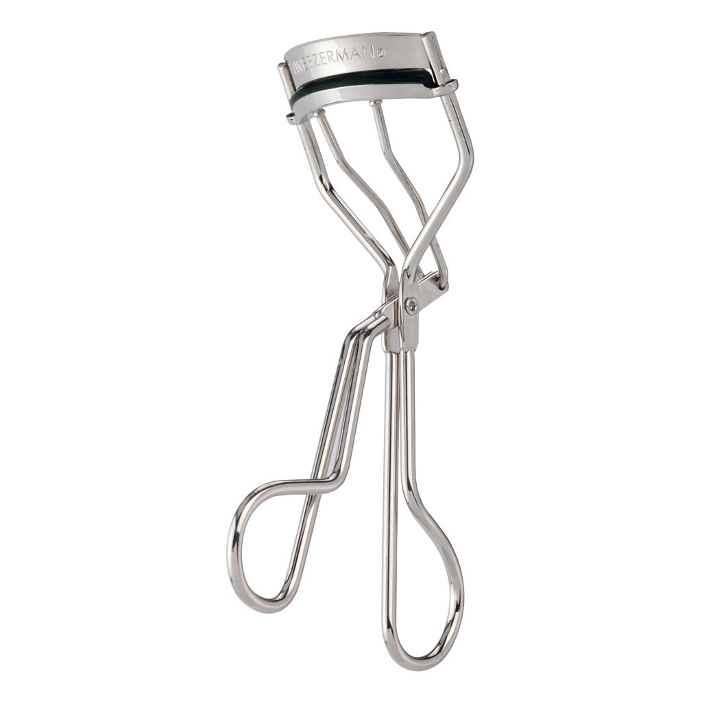Tweezerman classic eyelash curler with silver metal clamp and black handle for perfect eyelash curling in makeup routine