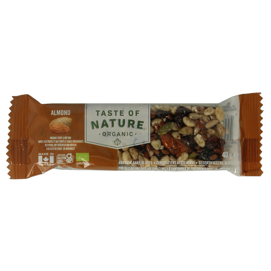 Taste Of Nature almond granenreep bio snack bar, showing whole almonds and oat grains in a vibrant, natural setting.