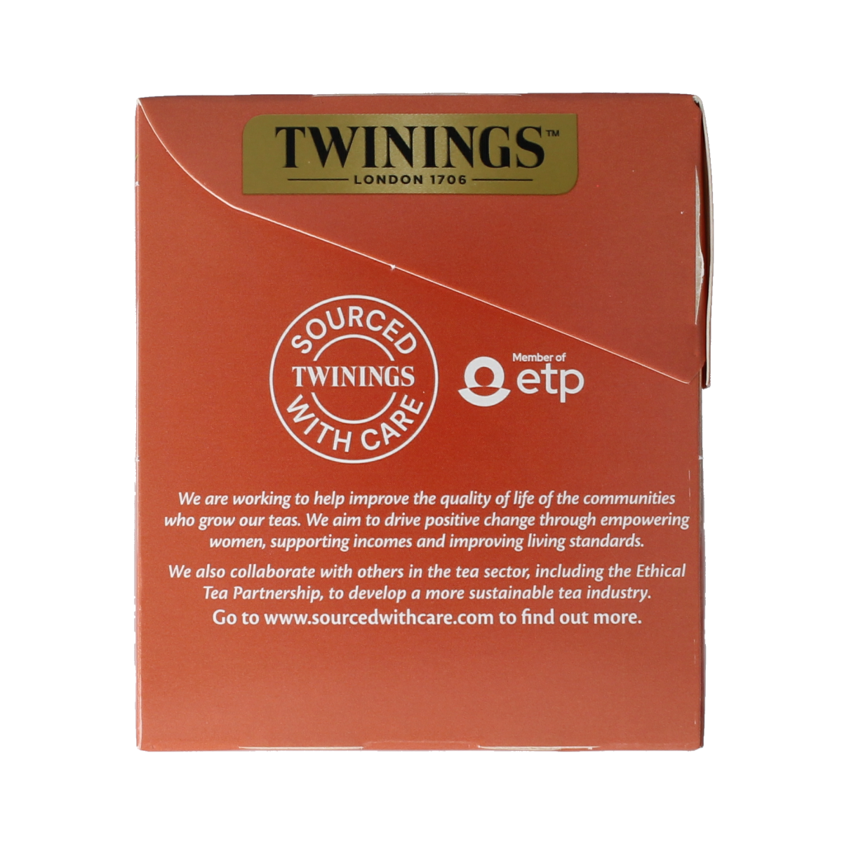 Twinings Apple Cinnamon Raisin tea bags in a box, featuring colorful packaging with images of apples, cinnamon sticks, and raisins.