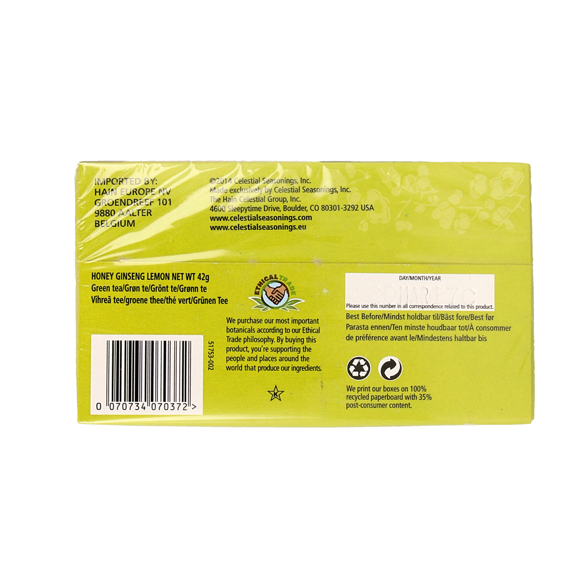 Celestial Season Honey Lemon Ginseng Green Tea sachets, packaging with tea bags and branding, in a natural setting.