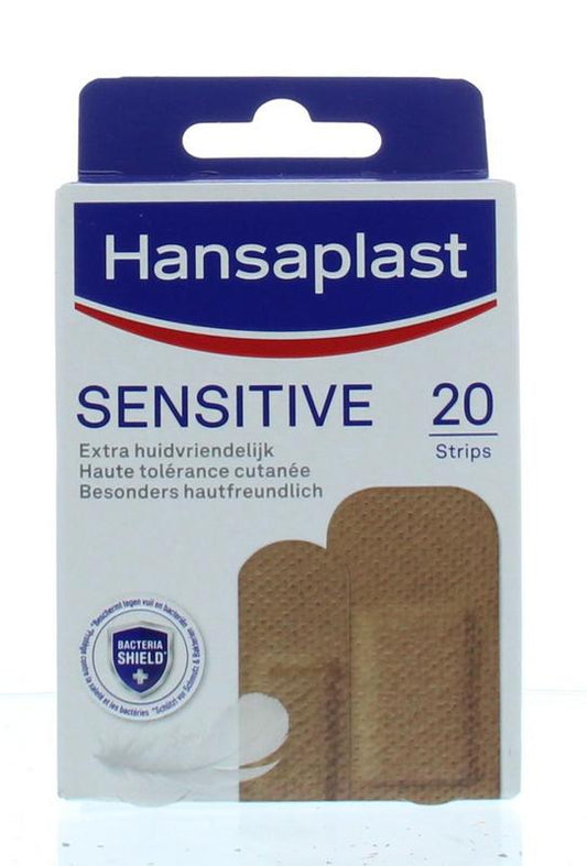 Hansaplast Sensitive skintone medium adhesive bandages on a white background, 20-piece pack for gentle skin protection.