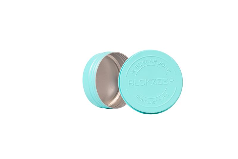 Empty Blokzeep shampoo and conditioner bar tin for bathroom use, compact metal container suitable for eco-friendly hair care products.