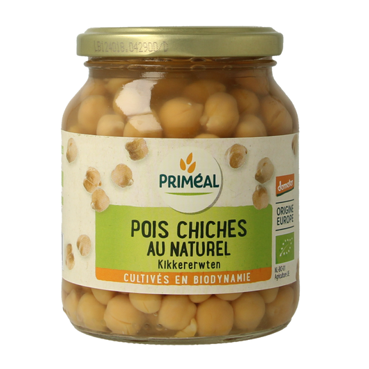 Primeal Demeter organic chickpeas in 350g package, positioned alongside potatoes, vegetables, and fruits on a grocery display.
