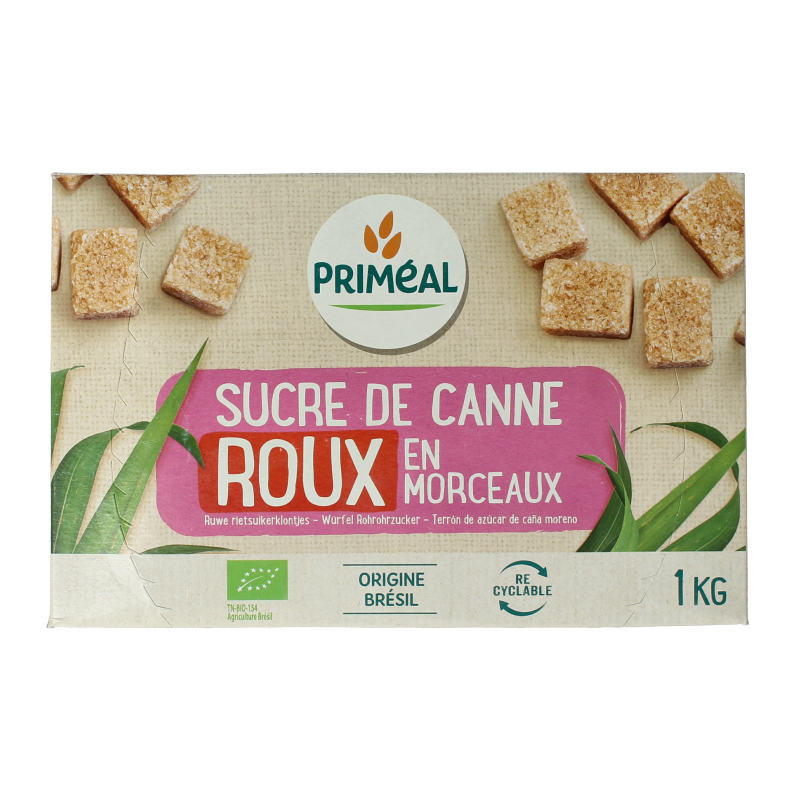 Primeal organic brown cane sugar lumps in a 1kg package, used for sweetening beverages and baking.