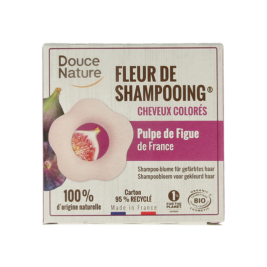 Douce Nature shampoo bar for colored hair, 85g, natural hair care product with purple packaging and textured soap surface.