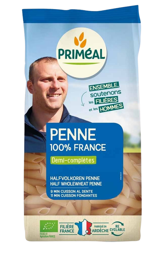 Primeal halfvolkoren penne pasta in a 500g package, made from organic whole wheat for a nutritious meal.