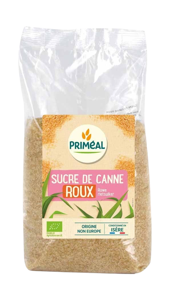 Primeal organic brown raw cane sugar in a 1kg bag, showing the textured, light brown sugar crystals for baking and sweetening