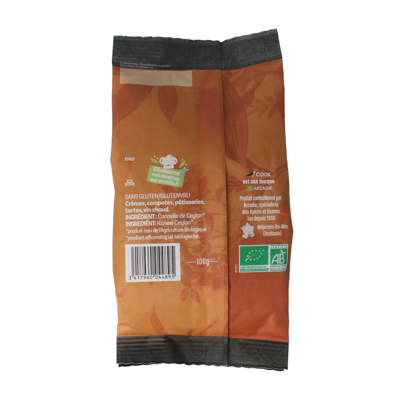 Ground organic cinnamon from Cook, shown in a 100 gram package, used as a spice in cooking and baking.