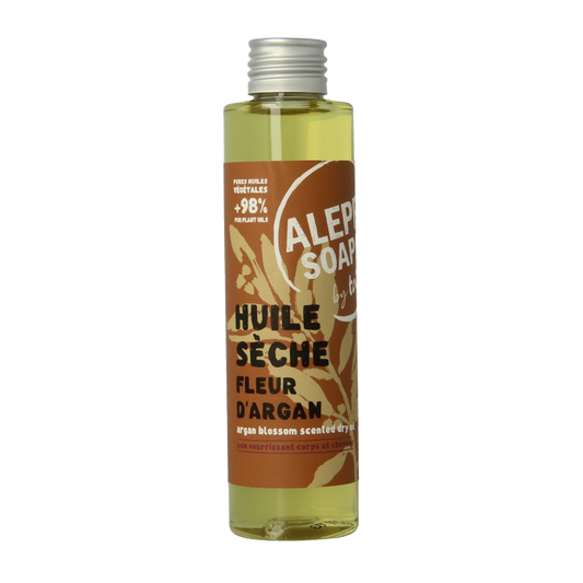 Aleppo Soap Co body oil with argan blossom, 160ml, nourishing body moisturizer in a clear glass bottle with a pump dispenser.