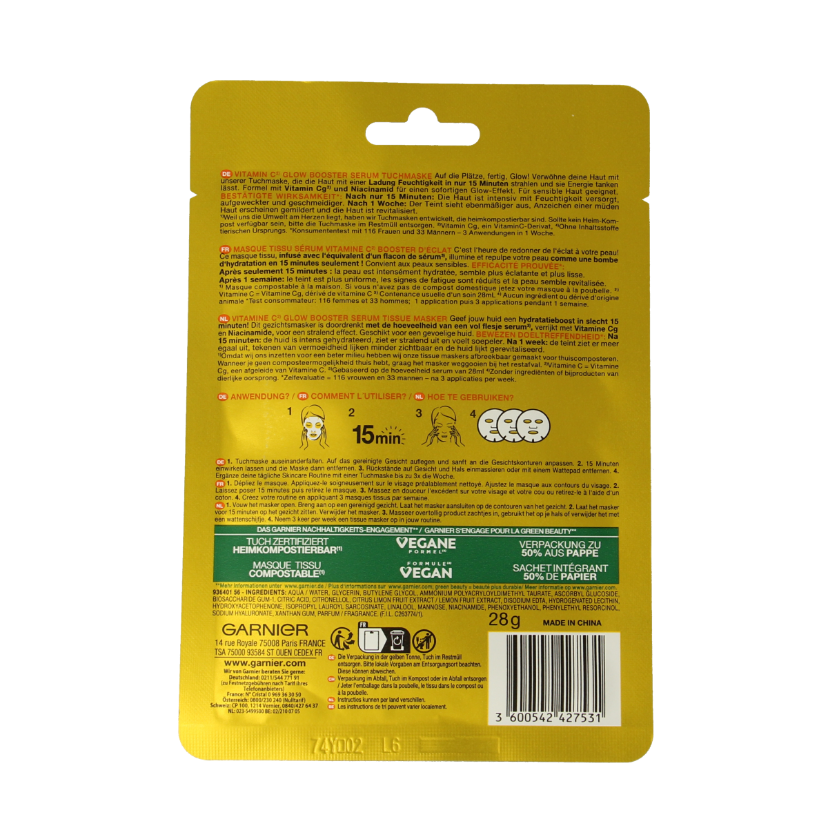 Garnier SkinActive Vitamin C sheet mask laid flat, showing packaging and fresh mask inside for facial skincare.