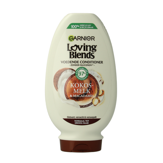 Garnier Loving Blends coconut milk conditioner for hair care, 250ml bottle with a white and blue label showing coconut images.
