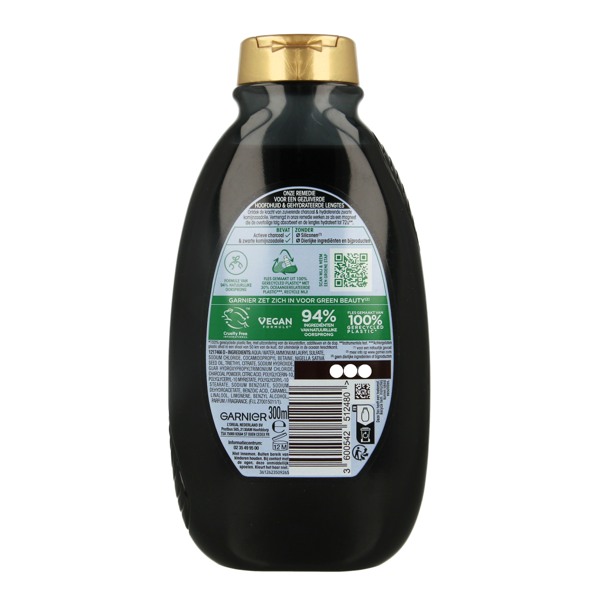 Garnier Loving Blends charcoal shampoo bottle, 300ml, for hair care with a natural and cleansing formula.