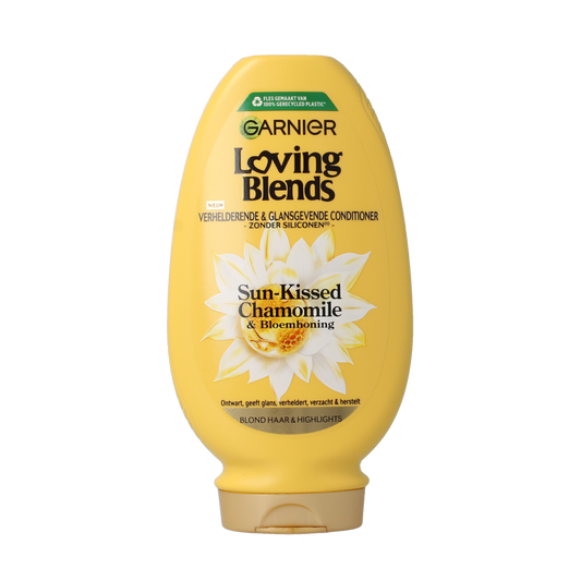 Garnier Loving Blends chamomile conditioner bottle for hair care, 250ml, with a white and yellow label and floral design.