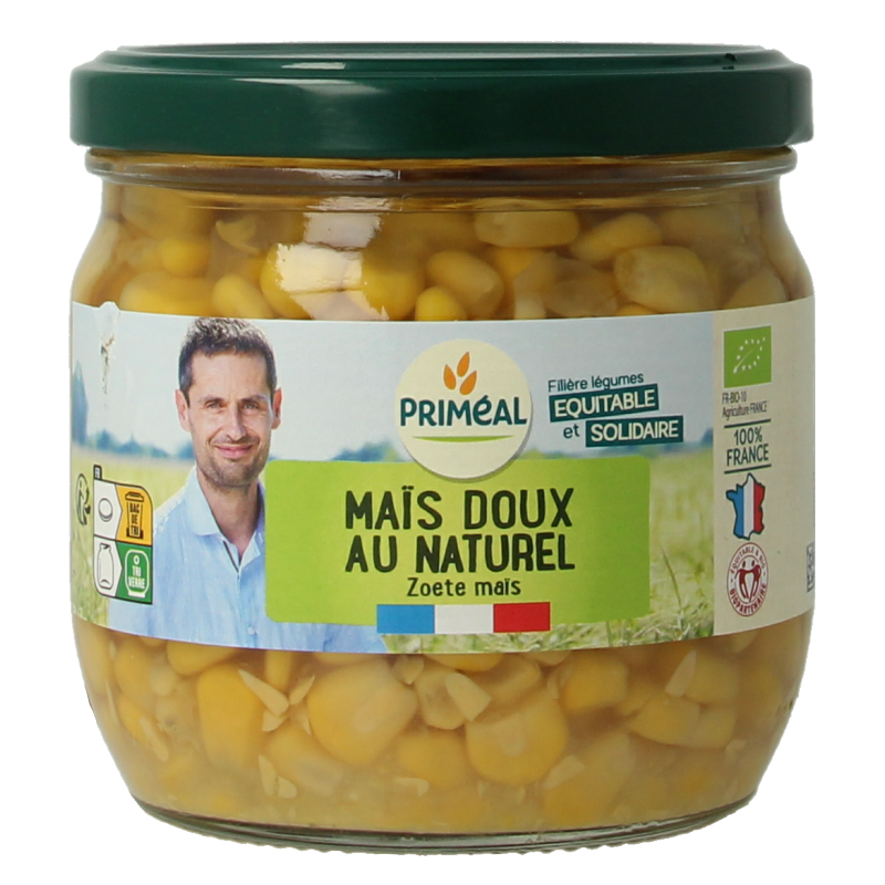 Canned organic Primeal corn in a 330g can, showing the label and contents of bright yellow corn kernels.