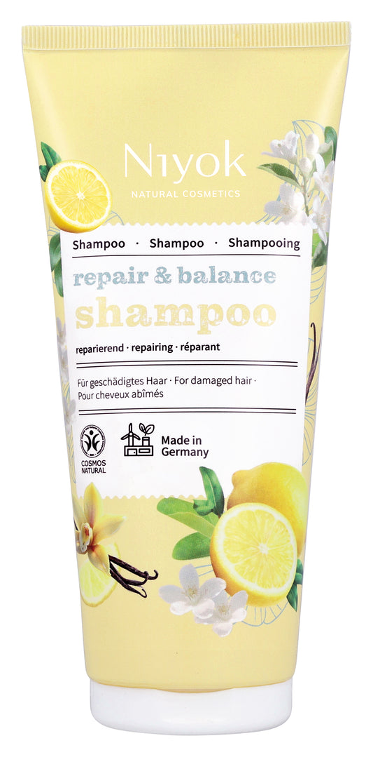 Niyok Repair & Balance shampoo in a 200ml tube, suitable for hair care and repair, with a sleek white and blue design.