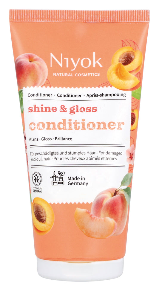 Niyok Shine & Gloss conditioner in a 150ml tube for hair care, featuring sleek packaging and hair shine enhancement.