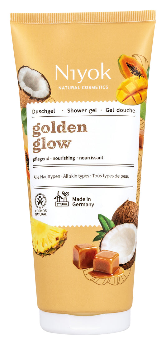 Niyok Golden Glow shower gel in a 200ml tube, displaying the product label and golden accents on the packaging.