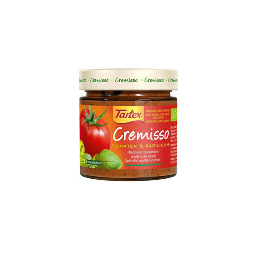 Tartex Cremisso tomato basil organic spread on bread, showing creamy texture and fresh basil leaves for breakfast or snack.