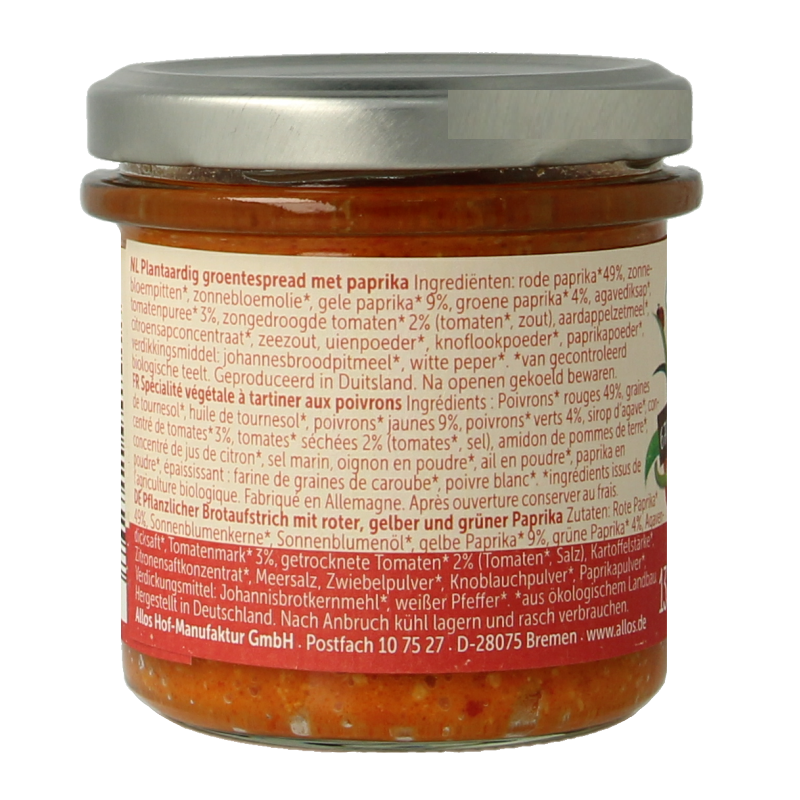 Allos Farm bio vegetable pepper trio spread on whole grain bread, showcasing vibrant red, yellow, and green peppers.