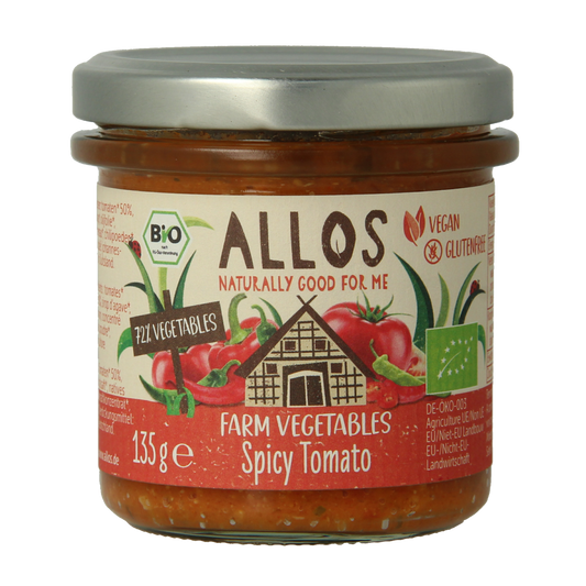 Allos Farm organic spicy tomato vegetable spread on bread, in 135g jar, with visible tomato chunks and herbs.