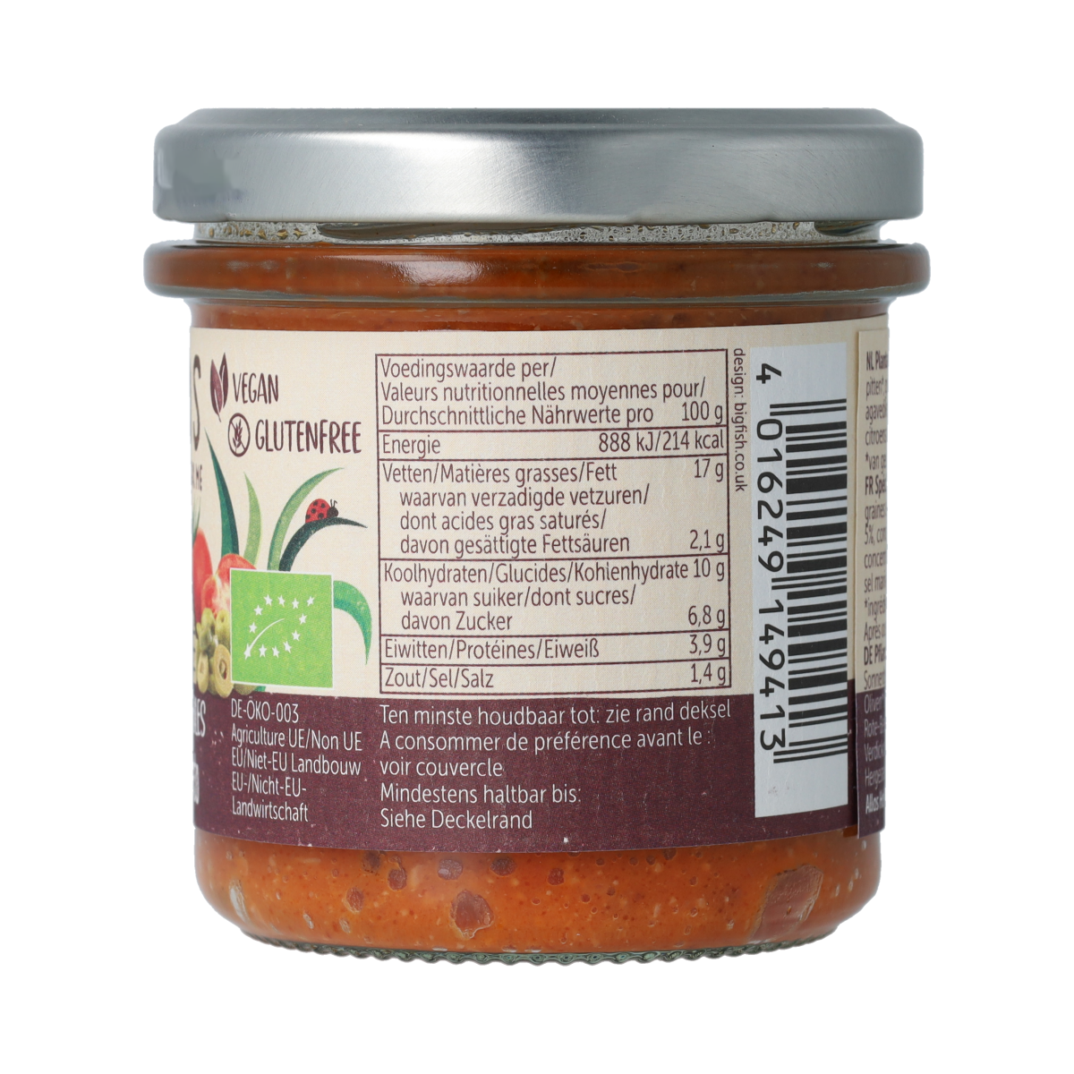 Allos Farm organic tomato and olive spread on bread, showcasing vibrant vegetables and creamy texture in a jar.