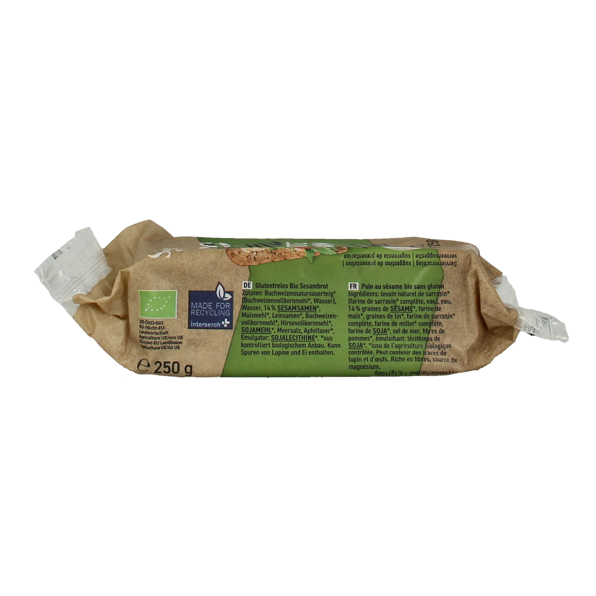 Schnitzer gluten-free organic sesame bread loaf, 250g, with visible sesame seeds on crust, in a natural setting.