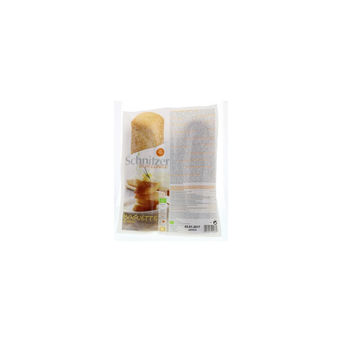 Schnitzer gluten-free organic baguette bread, whole and fresh, displayed on a wooden surface.