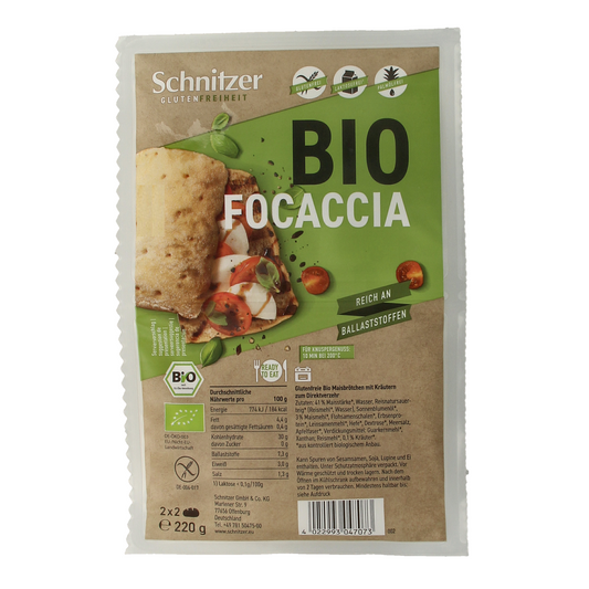 Schnitzer gluten-free bio focaccia bread, 4 pieces, 220g, shown on a white surface with a golden crust and soft interior.