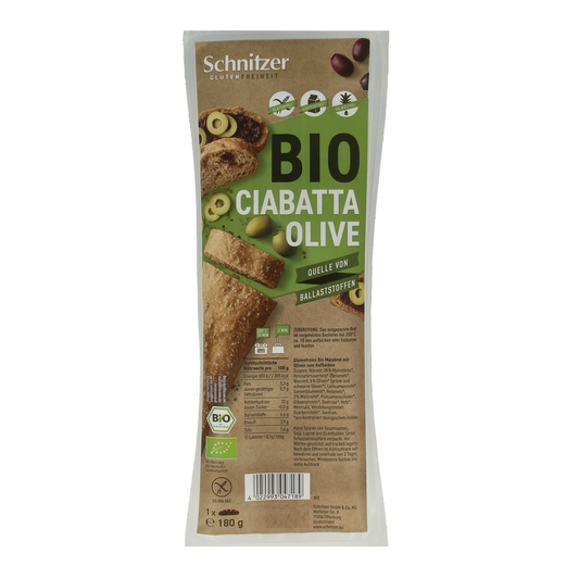 Gluten-free Schnitzer ciabatta bread with olives, organic, 180g, displayed on a rustic wooden surface.
