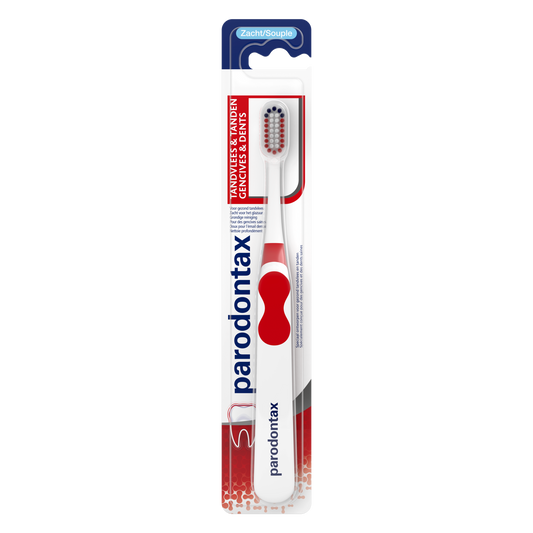 Soft Parodontax toothbrush with white handle and bristles, designed for gentle and effective dental cleaning.