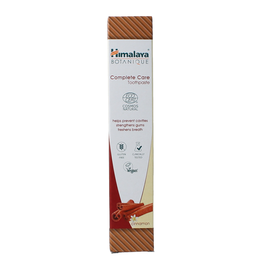 Himalaya Botanique Complete Care Cinnamon toothpaste in 75g tube with herbal packaging and natural ingredients visible.