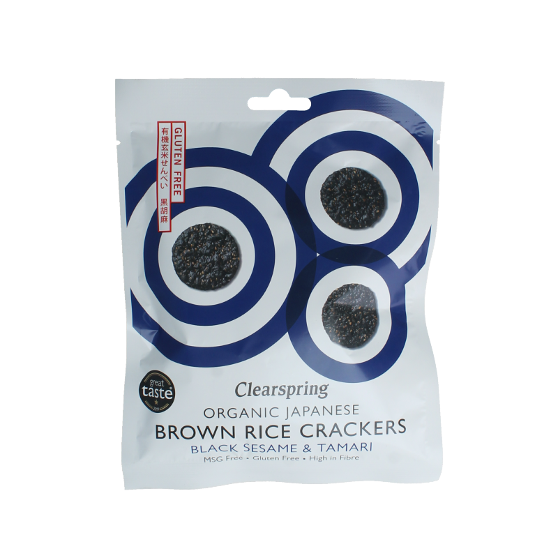 Clearspring organic brown rice crackers with black sesame seeds and tamari, 40 grams, in a natural snack setting.
