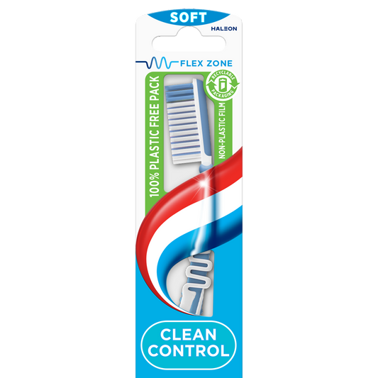 Aquafresh Clean Control Soft toothbrush with blue and white bristles, displayed next to a tube of toothpaste.