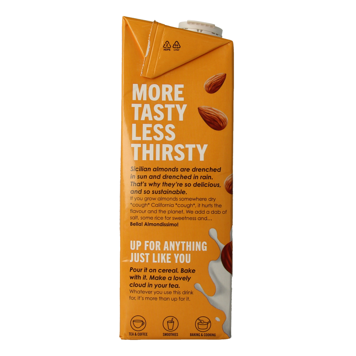 Glass of Rude Health organic almond drink in a 1-liter bottle, showing the label and almond beverage inside.