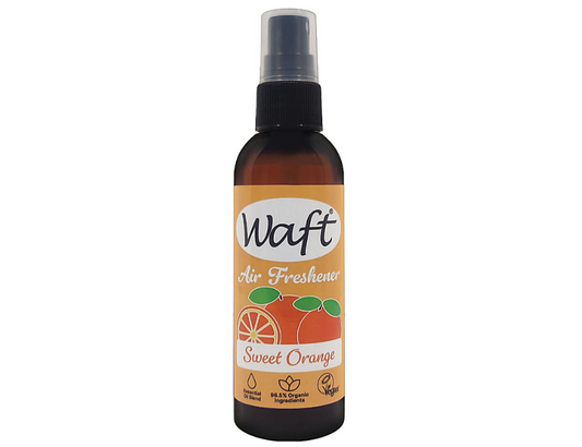 Waft sinaasappel luchtverfrisser spray bottle, 100ml, in a sleek container with orange citrus label, for freshening indoor spaces.