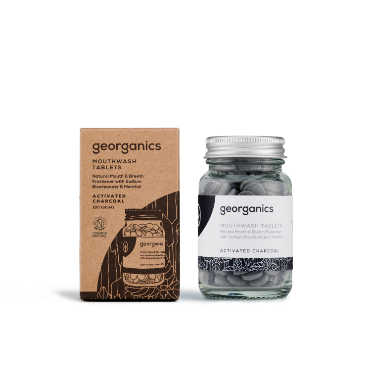 Georganics activated charcoal mouthwash tablets in a clear container, showing 180 tablets for oral care and freshening breath.