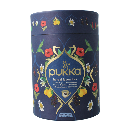 Pukka Herbal Favorites Kilner jar with 30 herbal tea and coffee sachets, featuring colorful packaging and brand logo.