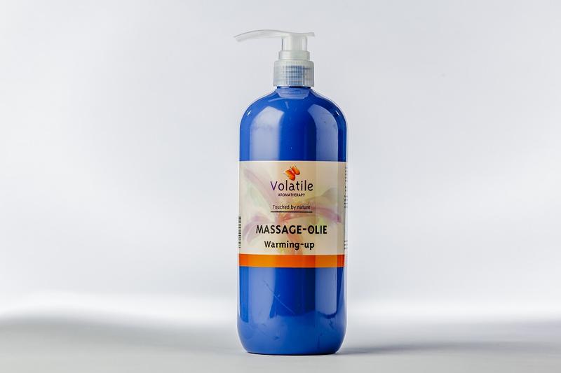 Volatile warming massage oil bottle, 1 liter, natural body care product with smooth, amber-colored liquid for relaxing massages.