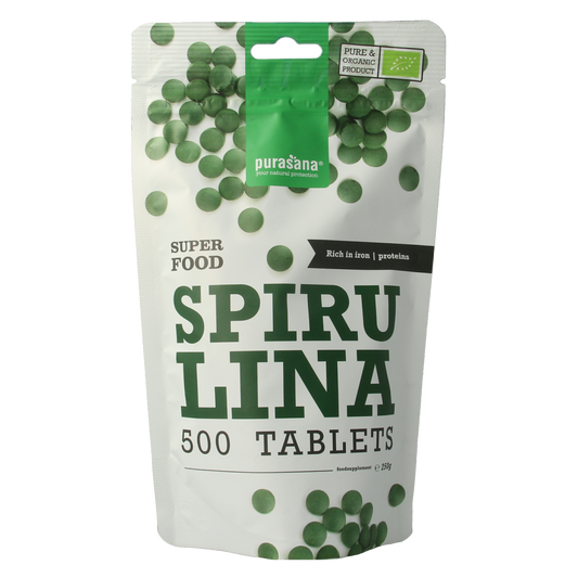 Purasana Spirulina 500mg organic tablets in a container, dietary supplement for health and wellness.