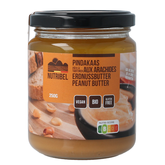 Organic Nutribel peanut butter spread on bread, 250g jar, natural broodbeleg with rich peanut flavor.