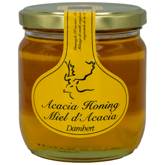 Damhert Acacia honey jar, 500 grams, with golden honey visible through the clear glass container.