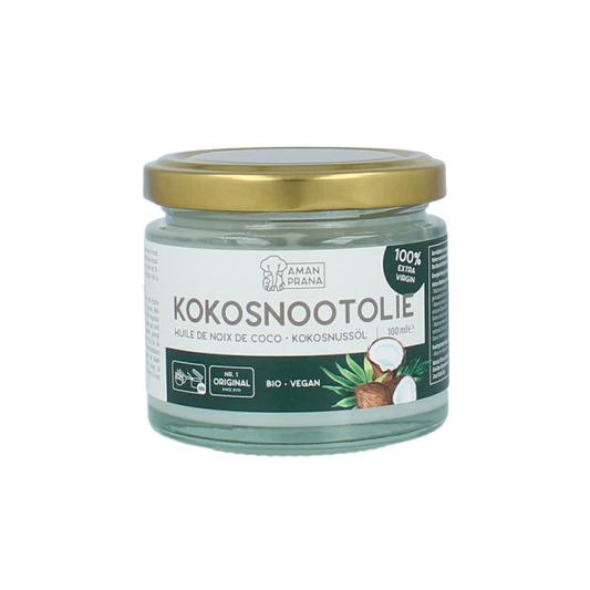Amanprana bio coconut oil in a 100ml bottle, showcasing the clear, golden oil in a glass container.