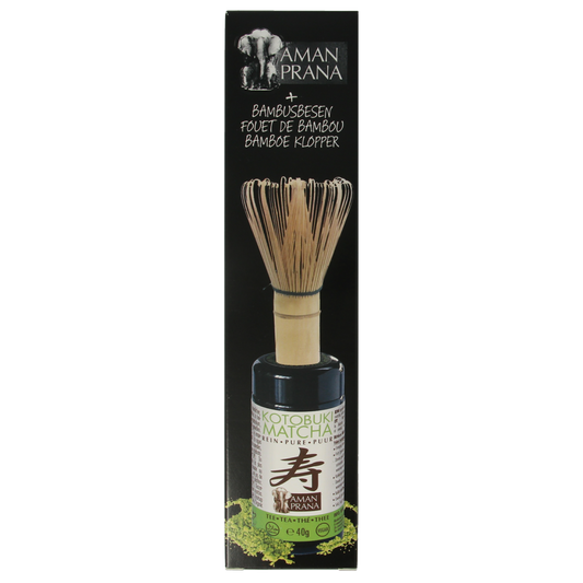 Amanprana Kotobuki matcha with bamboo whisk, organic green tea powder in a 40g package, ideal for traditional tea preparation.