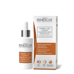 Remescar Vitamin C serum for facial skincare in a 30ml bottle, featuring a clear dropper and bright orange packaging.