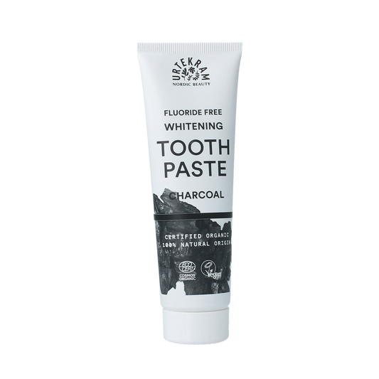 Urtekram bio active charcoal toothpaste in 75ml tube, natural dental care with whitening and detoxifying properties.