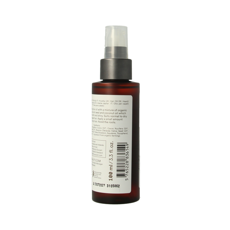 Urtekram coconut hair oil in 100ml bottle, natural hair care product, showing the bottle with coconut oil for nourishing hair.