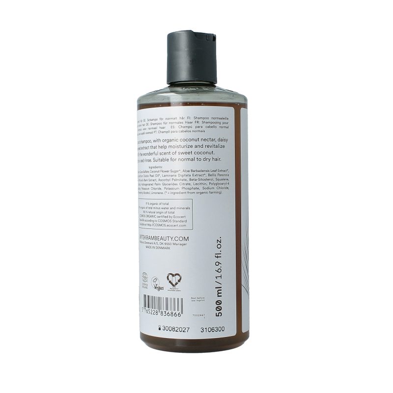 Urtekram kokosnoot shampoo bottle, 500ml, natural hair care product with coconut extract, standing upright on a plain background.