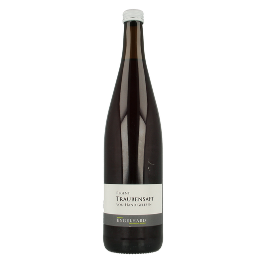Bottle of Wein Engelhard organic red grape juice, 750ml, in clear glass with label visible, in a natural setting.