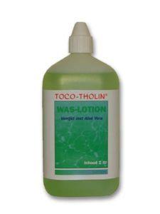 Toco Tholin Waslotion 1L bottle for body care, featuring a white label and cap, designed for nourishing skin.